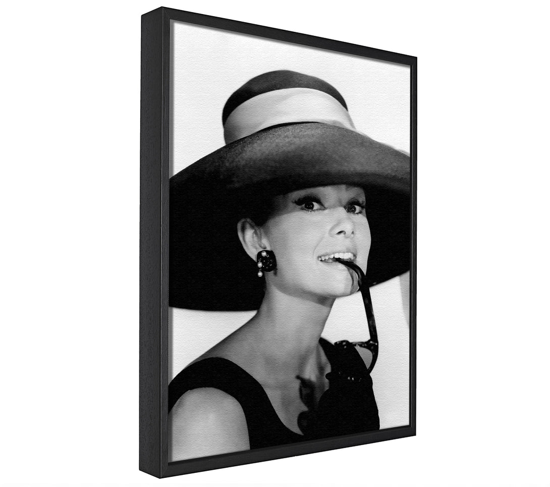 A picture of a Audrey Hepburn Hat framed canvas print sold by Wallart-Direct.co.uk