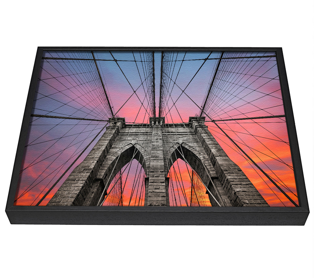 A picture of a Fire Skies Above Brooklyn Bridge framed canvas print sold by Wallart-Direct.co.uk