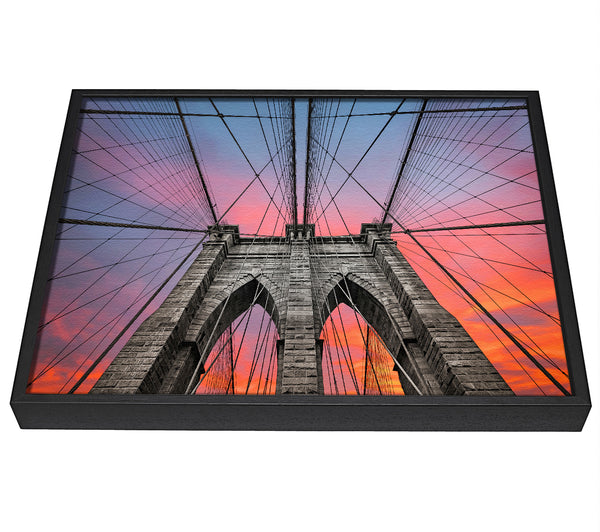 A picture of a Fire Skies Above Brooklyn Bridge framed canvas print sold by Wallart-Direct.co.uk