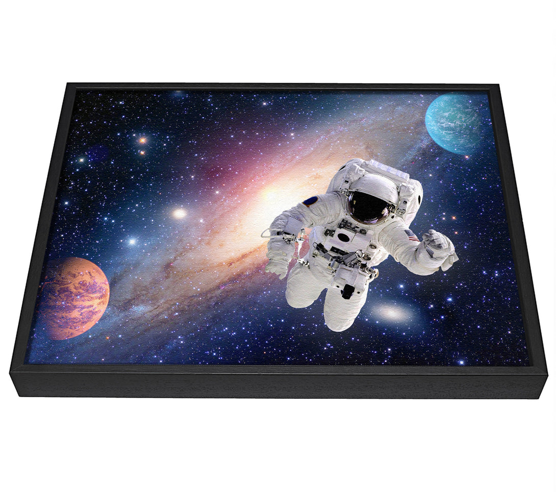 A picture of a Spaceman In The Galaxy framed canvas print sold by Wallart-Direct.co.uk