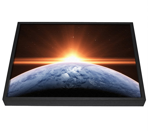 A picture of a Sun peering over the earth framed canvas print sold by Wallart-Direct.co.uk