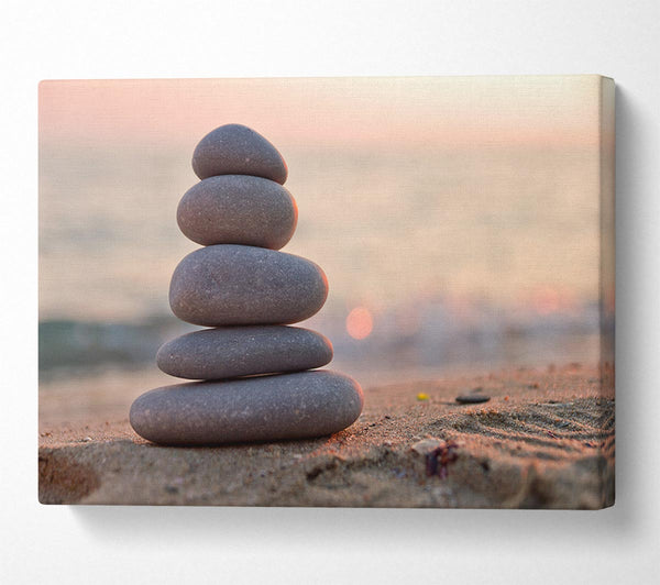 Zen stones stacked up on beach