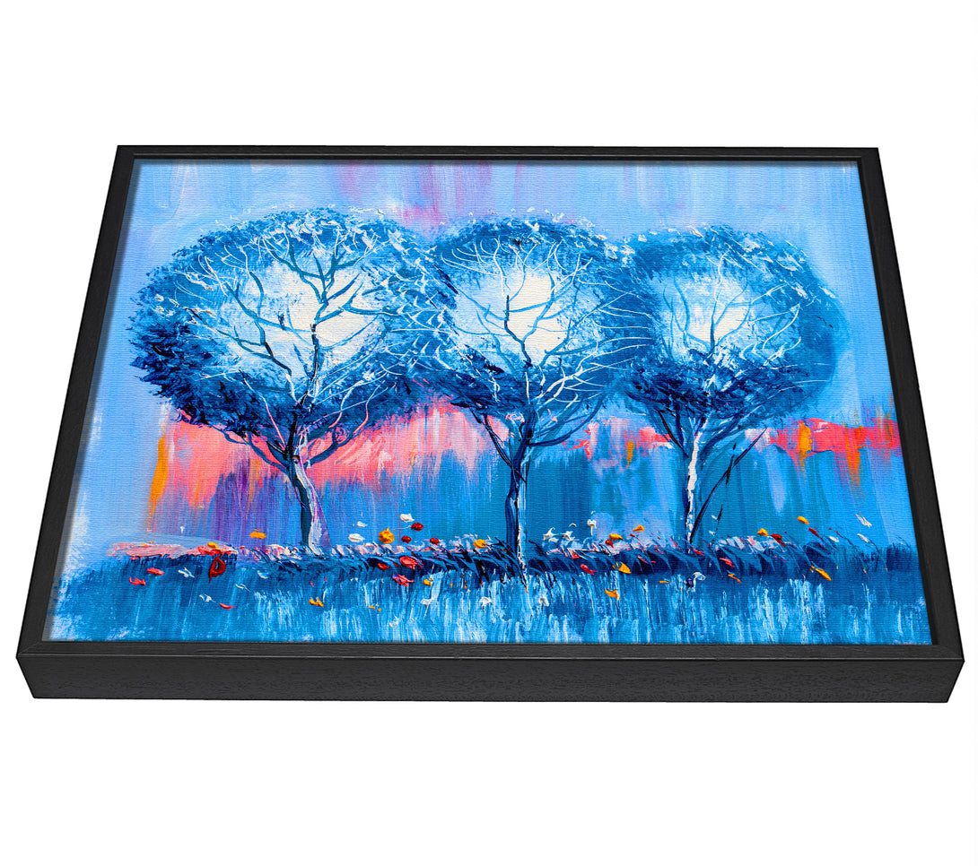 A picture of a Three Blue Winter Trees framed canvas print sold by Wallart-Direct.co.uk