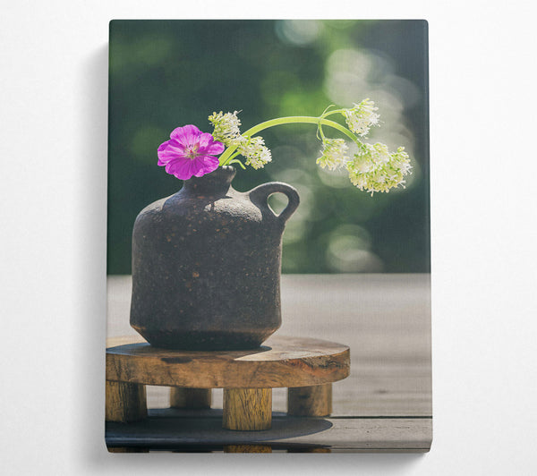 Black Vase With Purple Bloom.