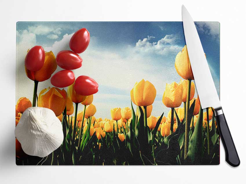 Yellow Tulips In The Cloudy Skies Glass Chopping Board