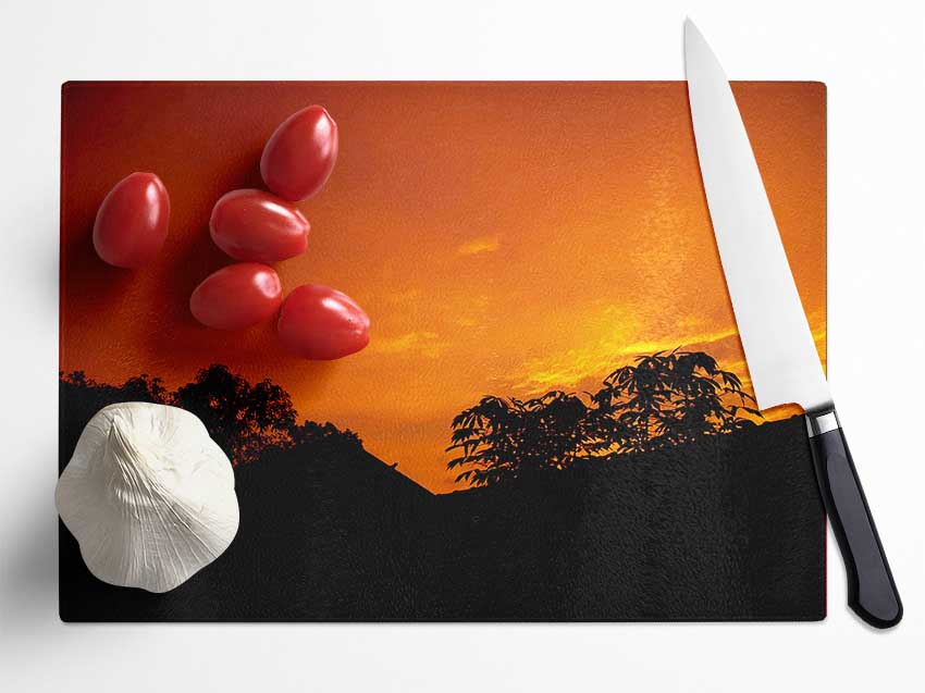 Orange Skys Over Forest Glass Chopping Board