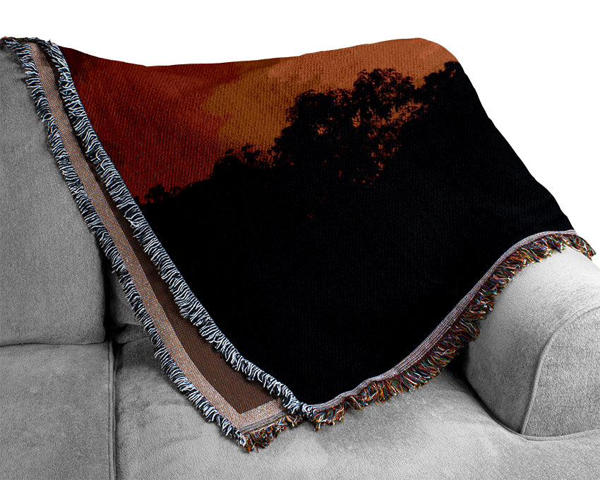 Orange Skys Over Forest Woven Blanket