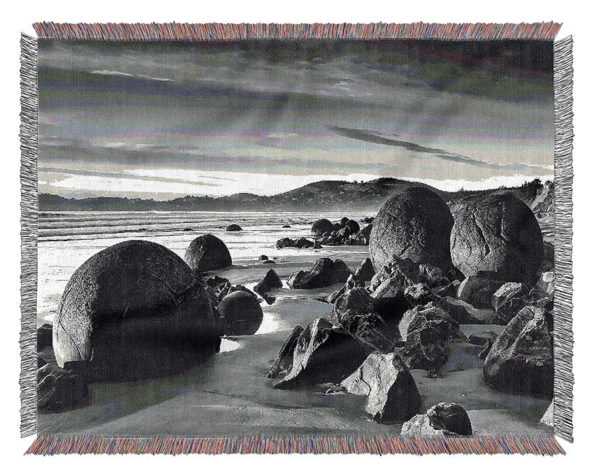 Rocks On A Beach Woven Blanket