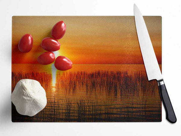 Sunset Over The Oceans Reeds Glass Chopping Board