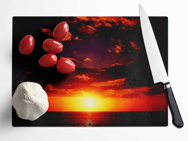 Sunset Through The Black Ocean Clouds Glass Chopping Board