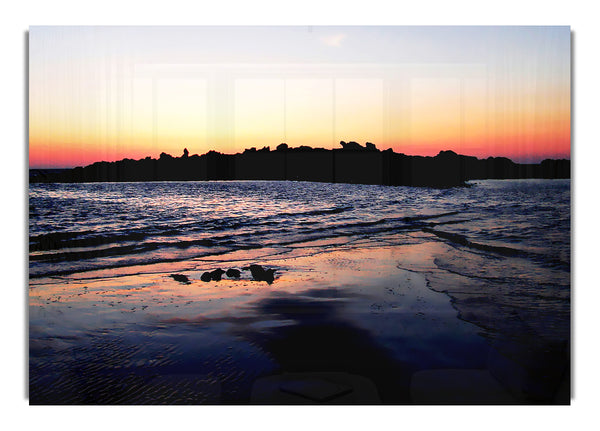 Sunset Behind The Ocean Rocks