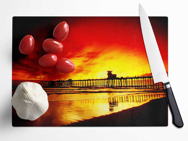 Fire Skies Over The Pier Glass Chopping Board