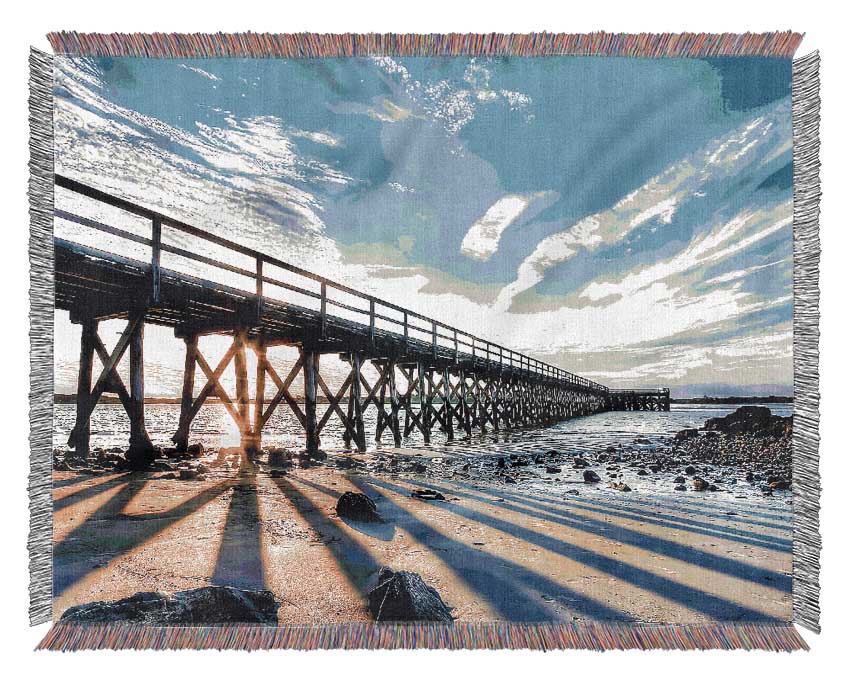 Sun Peaks Through The Pier Woven Blanket