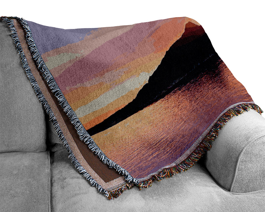 As The Sun Peeps Over The Mountain Ocean Woven Blanket