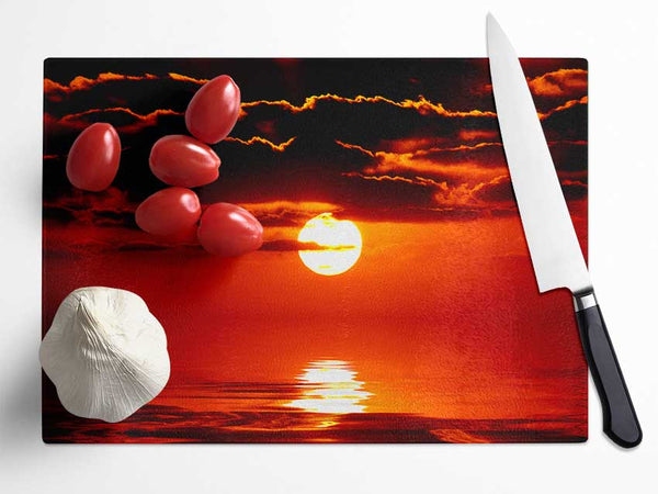 Orange Sun Clouds Over The Ocean Glass Chopping Board