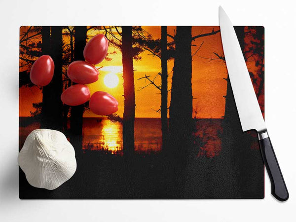 Orange Sunset Through The Trees Glass Chopping Board