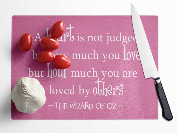 Movie Quote Wizard Of Oz A Heart Is Not Judged Pink Glass Chopping Board