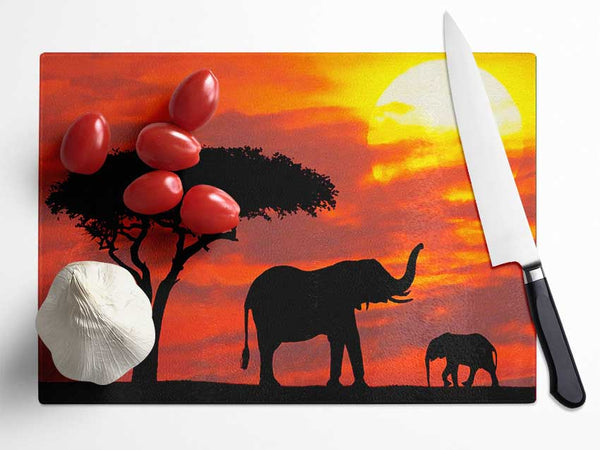 Mother And Baby Elephant Silhouetted At Sunrise Kenya Glass Chopping Board