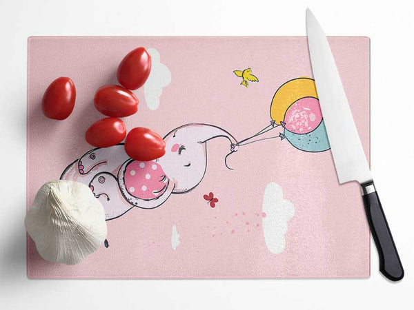 Pink Elephant Floating On Balloons Glass Chopping Board