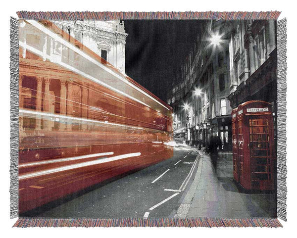 Red Bus Speeding Through The City Woven Blanket