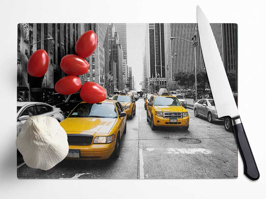 Yellow Cabs On The Inner City Steets Glass Chopping Board