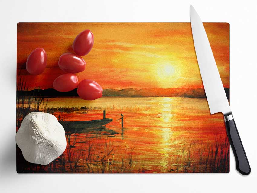 Row Boat On The Sunset Waters Glass Chopping Board