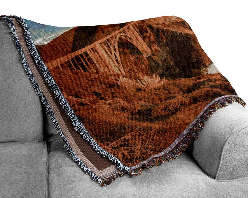 Bridge over the cliffs and cove Woven Blanket