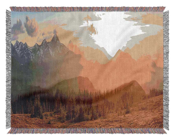 Tall mountains in the sunset Woven Blanket