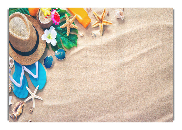 Sunglasses and hat on the beach