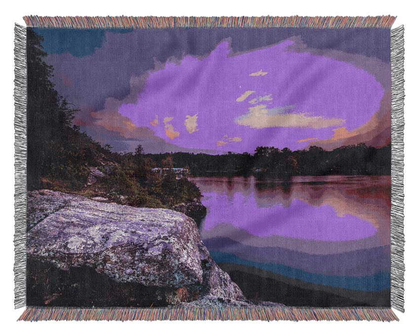 purple and blue lake off the cliffs Woven Blanket