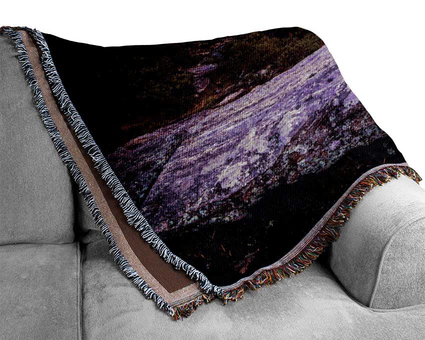 purple and blue lake off the cliffs Woven Blanket