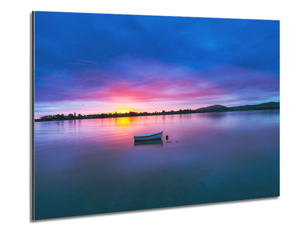 Small row boat on calm lake