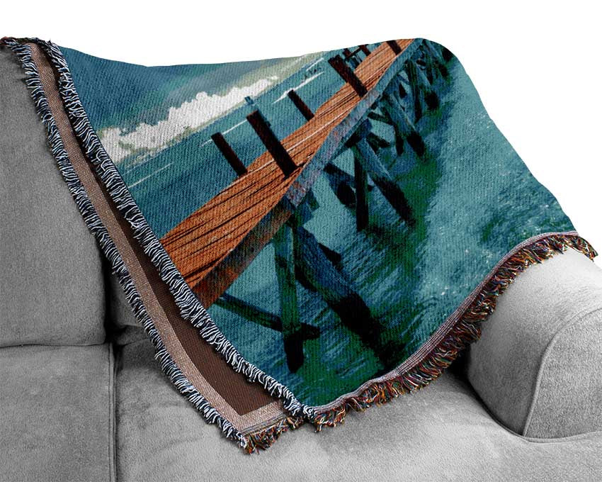 Blue rays on the pier Woven Blanket