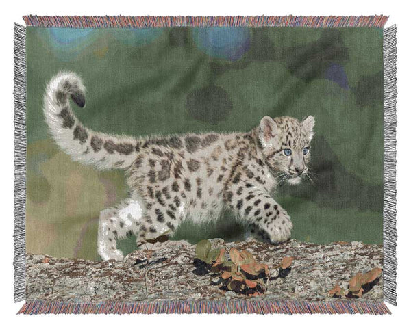 Leopard Cub walking a branch Woven Blanket