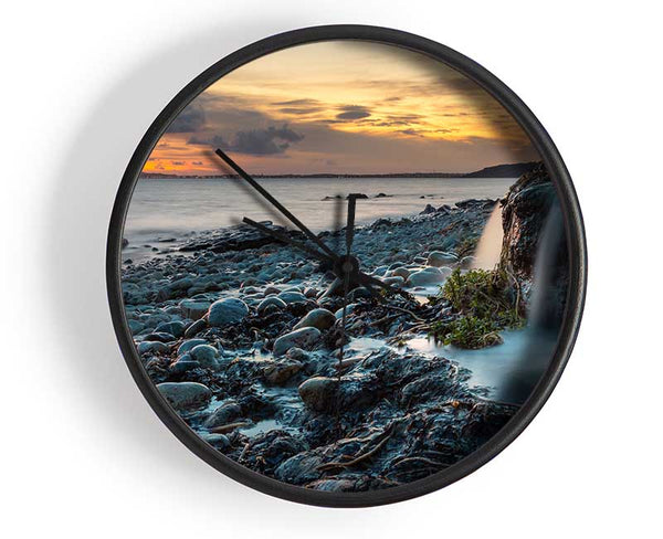 Water flows down the rocks into the sea Clock - Wallart-Direct UK