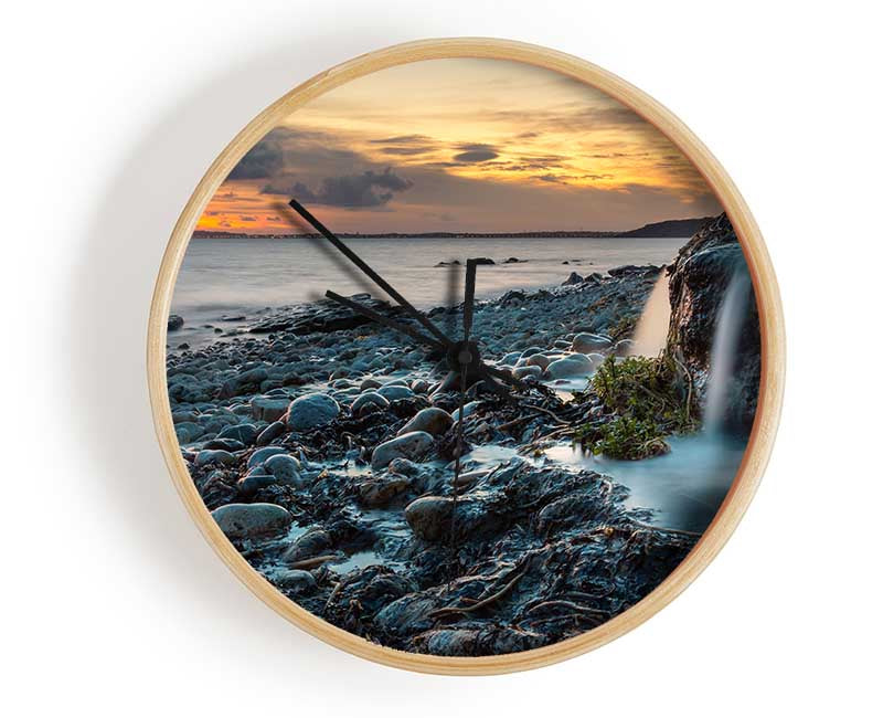 Water flows down the rocks into the sea Clock - Wallart-Direct UK