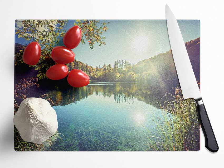 View of the lake through the branches Glass Chopping Board