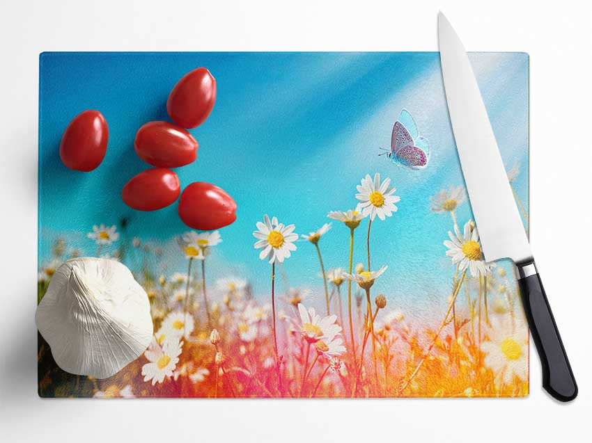 Butterfly landing on a daisy Glass Chopping Board