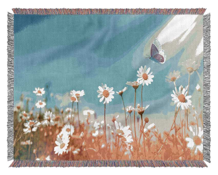 Butterfly landing on a daisy Woven Blanket