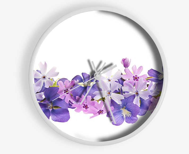 Pink and violet flowers laid out Clock - Wallart-Direct UK