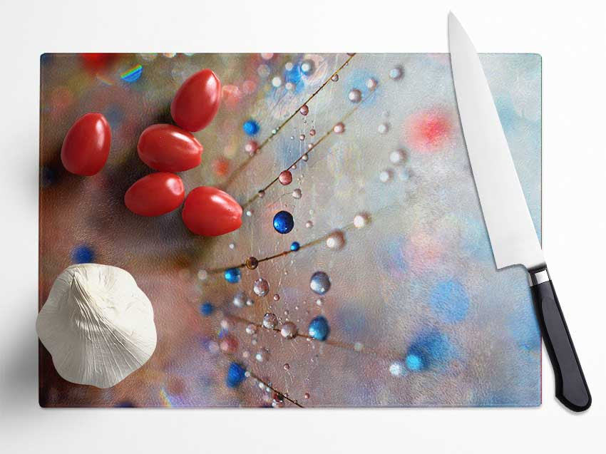 Droplets of colour on a flower Glass Chopping Board