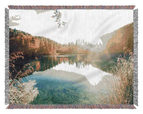 Sun shining on the calm river Woven Blanket