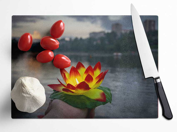 Flower candle in city view Glass Chopping Board