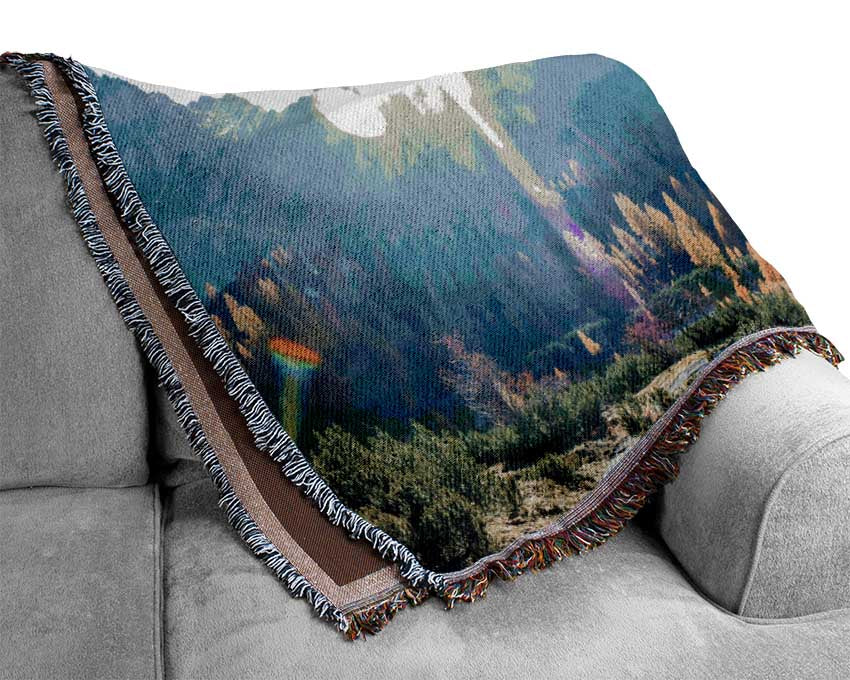 Mountain view of tall trees sunrise Woven Blanket