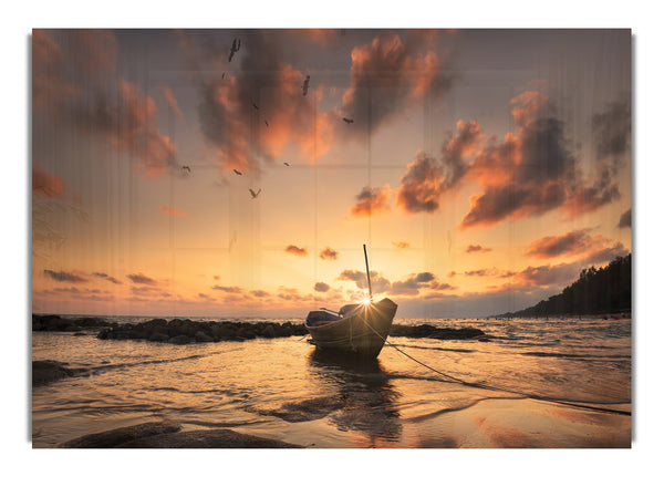 Sunset finishing boat on the beach