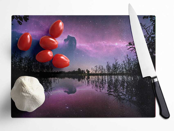 Horse head nebula over a purple lake Glass Chopping Board