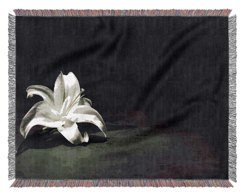 White lilly on the floor Woven Blanket