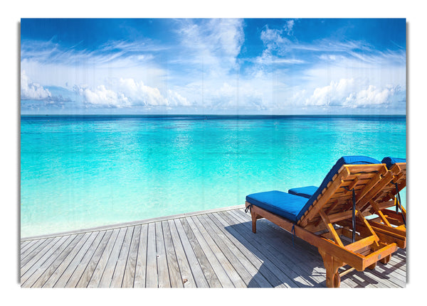 sunchairs on decking on the beach