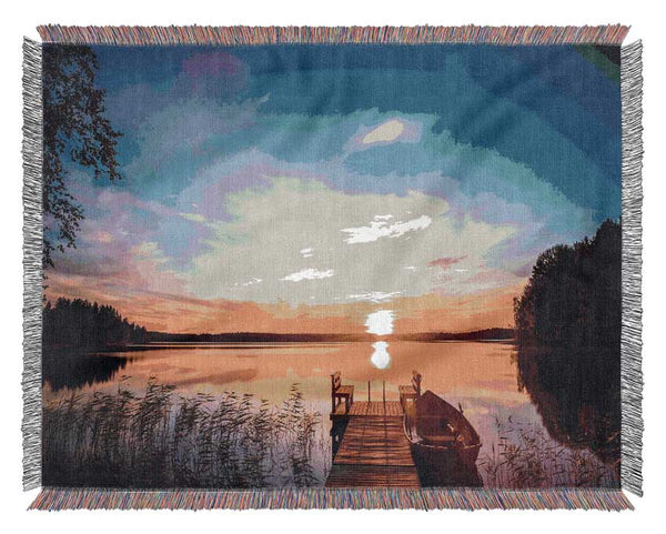 Rowing boat parked at the jeti Woven Blanket