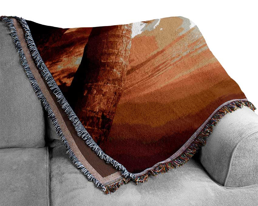 Low sunset at the beach Woven Blanket